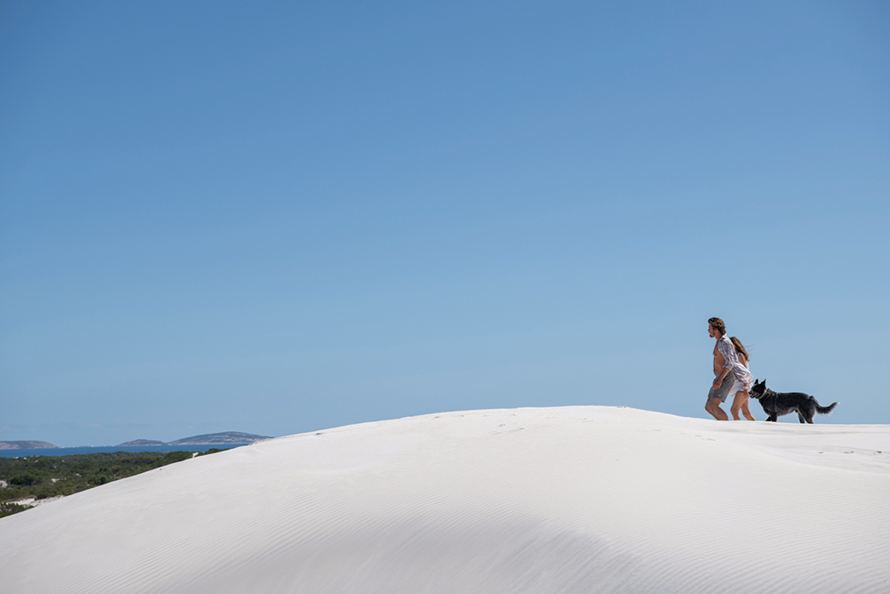 Lu Fox (Garrett Hedlund) and Georgie Jutland. Location: Wylie Bay Dunes. Credit: David Dare Parker