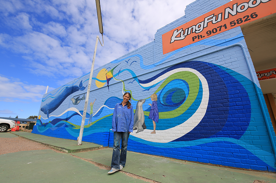 Esti Nagy with her mural