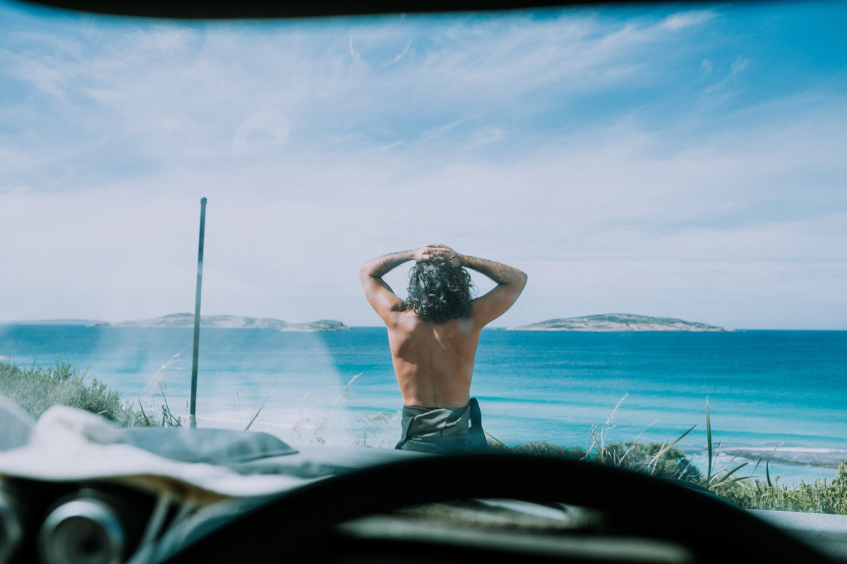 Surfer looking out to the ocean